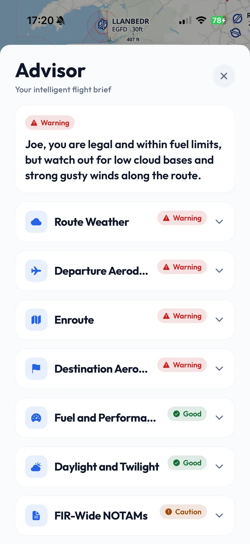 Aviate’s pre-flight brief on an iPhone. A red Warning chip sits over a summary reading “you are legal and within fuel limits, but watch out for low cloud bases and strong gusty winds along the route”, above a list of route weather, departure aerodrome, enroute, destination, fuel, daylight and NOTAM sections, each carrying its own status of warning, good or caution.